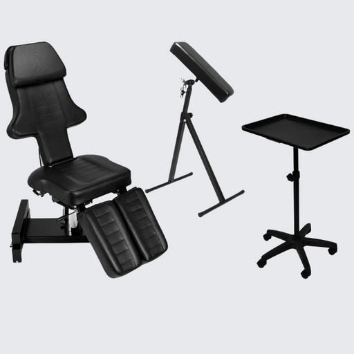 InkBed Hydraulic InkBed™ Complete Tattoo Package in black, featuring a fully adjustable hydraulic bed, removable armrests, and a complete set of accessories, designed for comfort and functionality in professional tattoo studios.